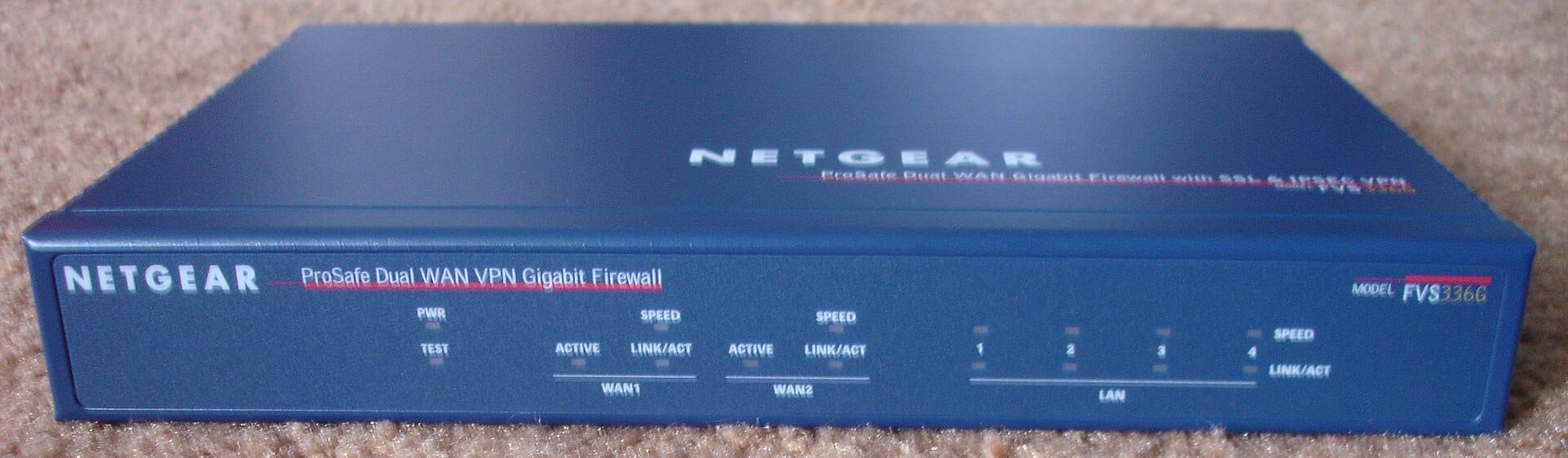 NETGEAR ProSafe dual-WAN VPN firewall appliance with WAN1, WAN2 and LAN indicator lights
